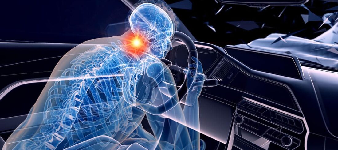 a disabled person sitting in a car with a red light on their head.