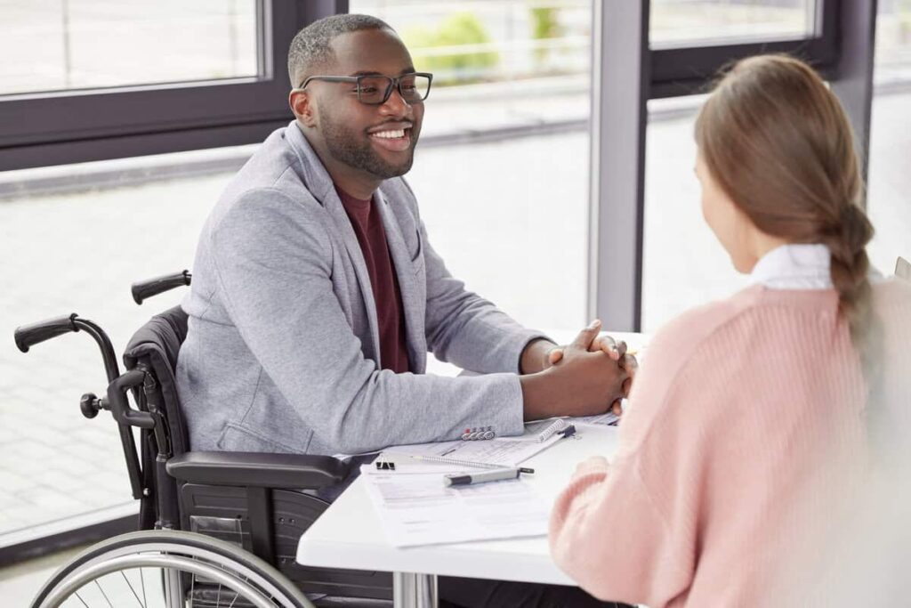 handsome-cheerful-black-male-invalid-in-wheelchair-2023-11-27-05-26-41-utc1 Find Out What Conditions Automatically Qualify You For Disability In 2023