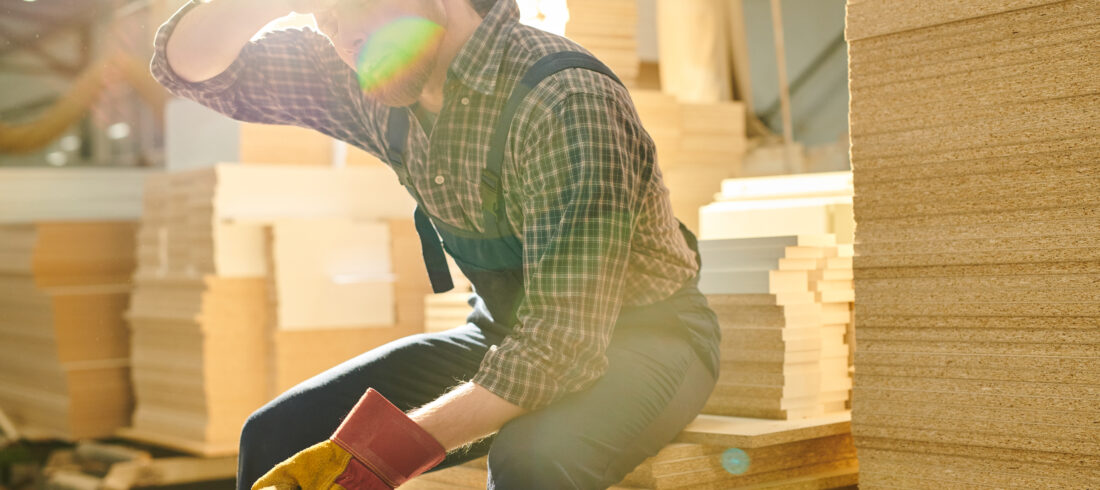 Exhausted worker wiping sweat from forehead Can You Be on Workers' Comp in Every State
