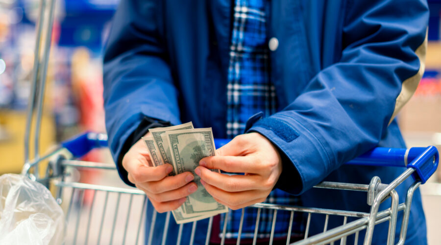 Man reviewing bills and financial assistance paperwork