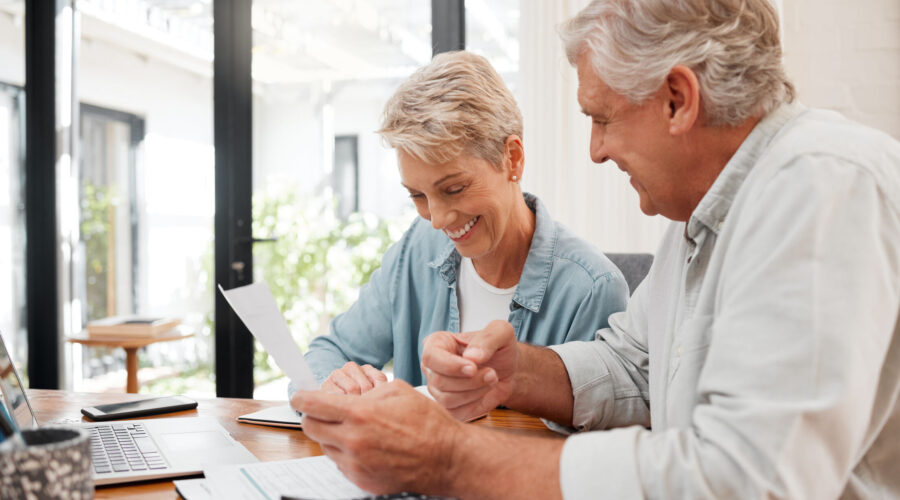 Senior couple checking finances and benefit eligibility